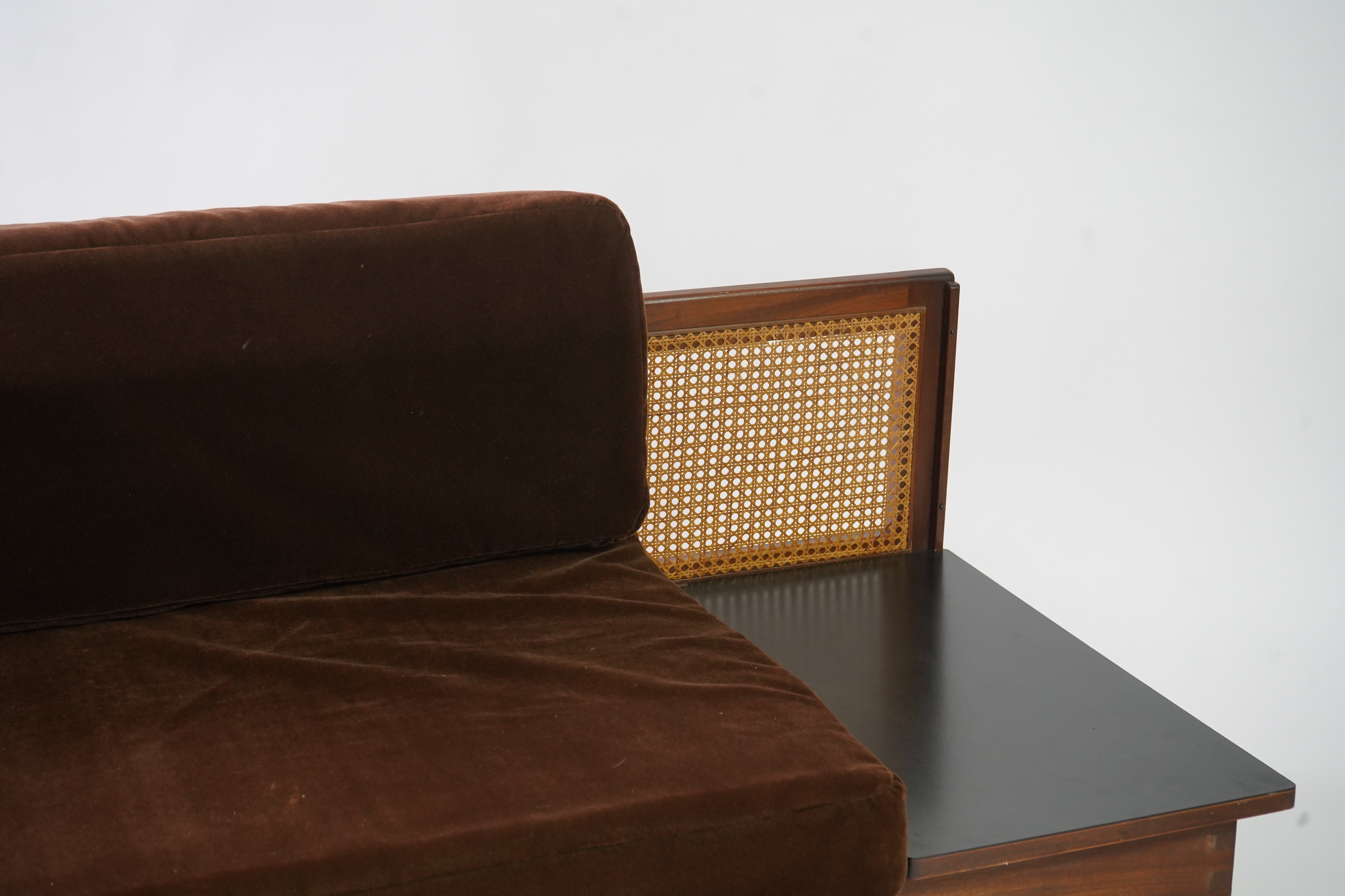 Dennis Young (British): A caned teak sofa/daybed